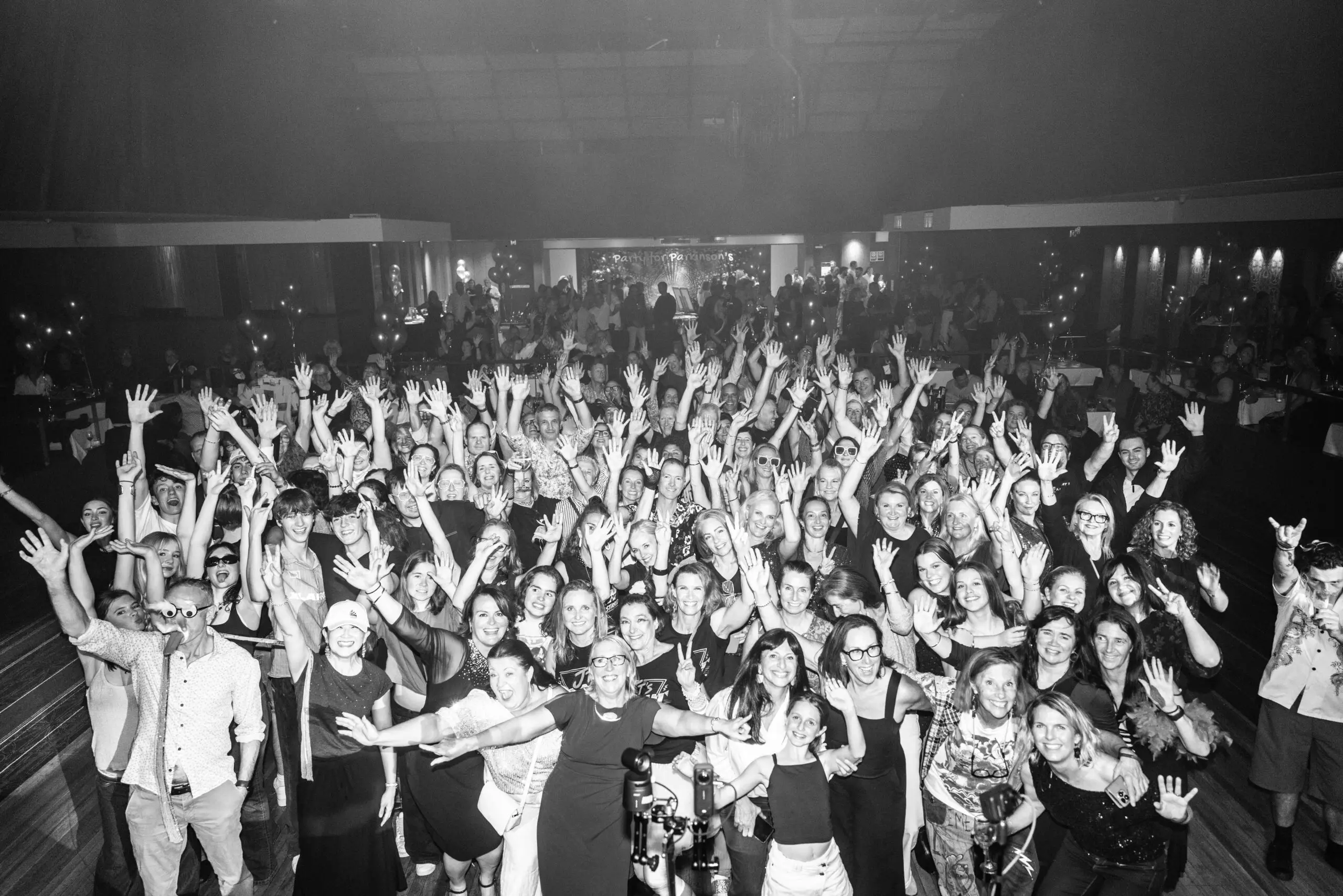 Concert audience waving at the camera